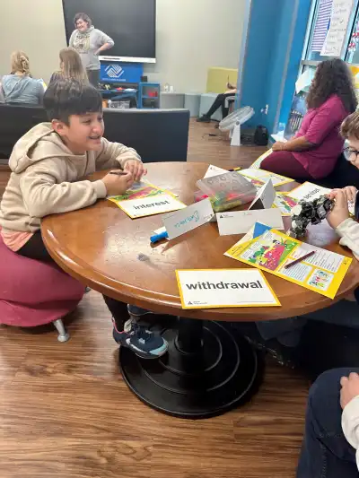 Students Looking at Workbook